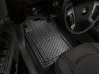 WeatherTech Front and Rear Heavy Duty AVM - Black floor mat in a vehicle.