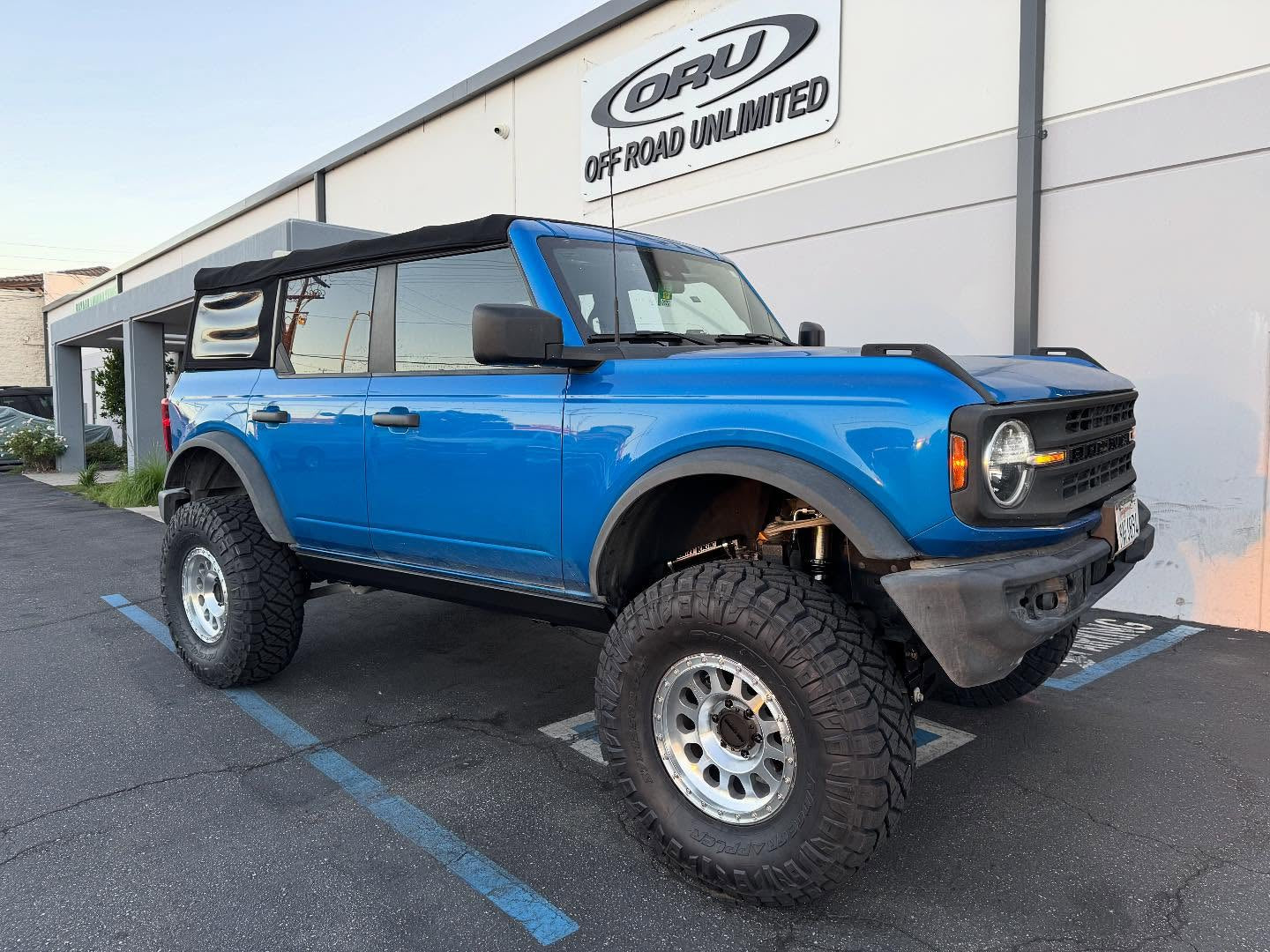 Blue off-road vehicle showcasing ORU parts and accessories.