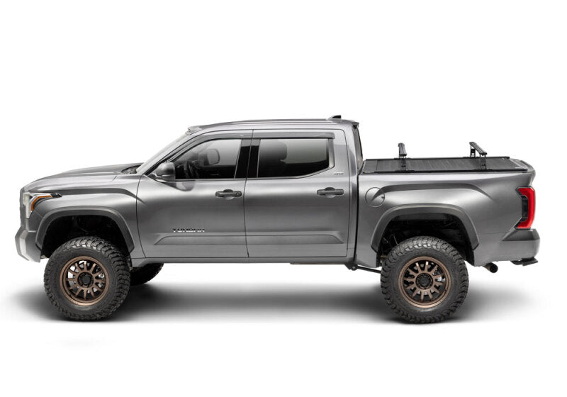 Retrax 2007-2020 Toyota Tundra CrewMax 5.5ft Bed RetraxPRO XR with Deck Rail System on offroad truck with performance upgrades.