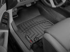 WeatherTech 12-14 Toyota Tacoma Front FloorLiners - Black in a truck interior, perfect fit and durable protection.