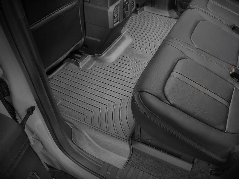 WeatherTech 2017+ Ford F-250/F-350/F-450/F-550 Crew Cab Rear FloorLiner - Black installed in truck interior.