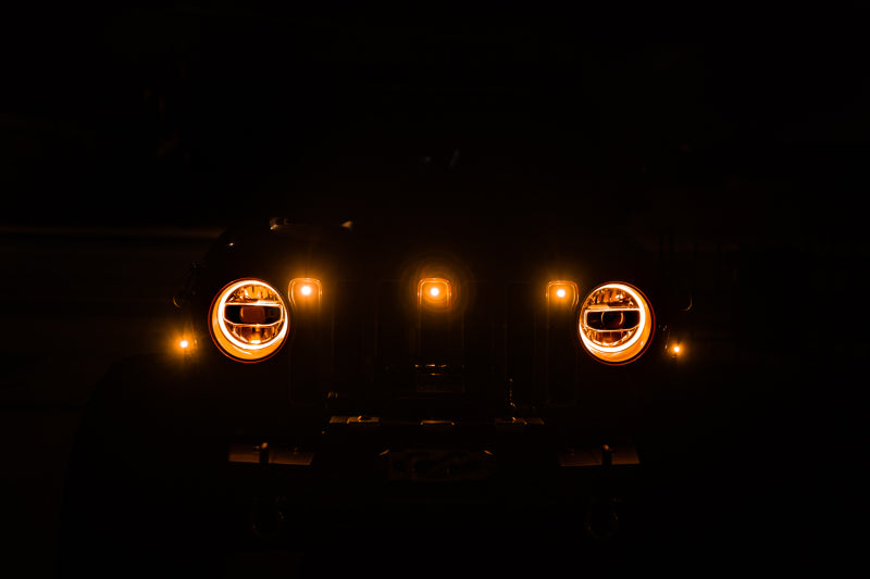 DV8 Offroad 2018+ Jeep JL Grill Amber Marker Lights in dark.