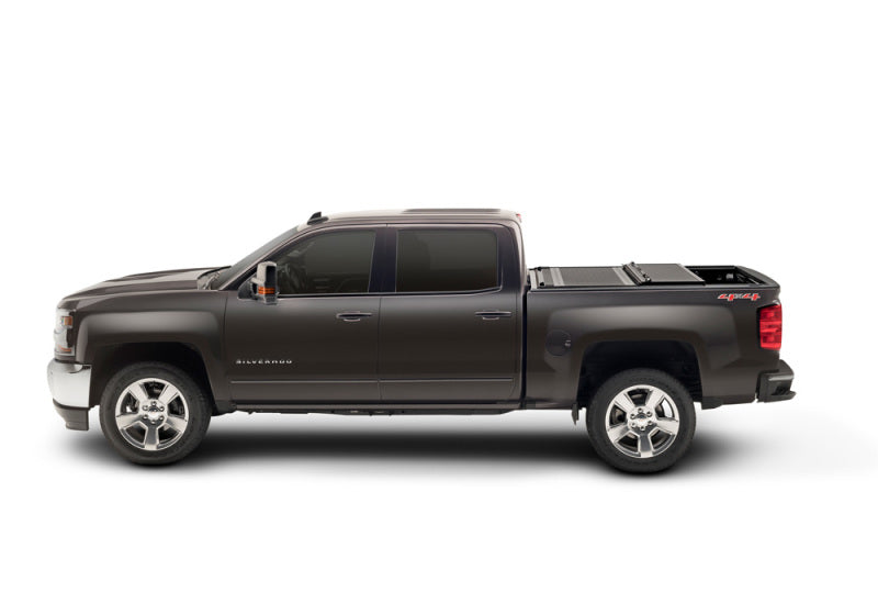 BAK 14-18 Chevy Silverado 1500 / 15-20 Chevy Silverado 2500/3500 6ft 6in Bed BAKFlip G2 on black truck with cover