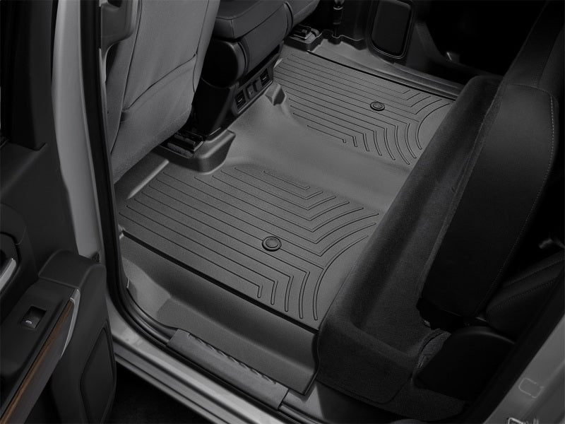 WeatherTech 19-23 Chevrolet Silverado 1500 Crew Cab (1st Row Bench Seats) Rear FloorLiner - Black shown in vehicle interior.