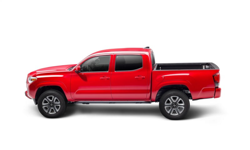 N-Fab Trail Slider Steps 16-20 Toyota Tacoma Crew Cab All Beds - SRW - Textured Black on red truck side view image