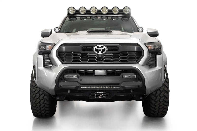 Addictive Desert Designs2024+ Toyota Tacoma Stealth Center Mount Winch Front Bumper w/ Top Hoop with offroad lighting and recovery gear.