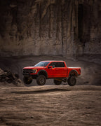ICON 21-24 Raptor Triple Rate Overland Coil Spring Kit on off road terrain