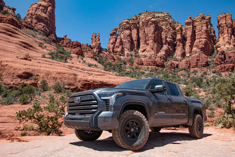 ICON 22+ Toyota Tundra 2.5 EXP Front Coilover Shock on rugged terrain