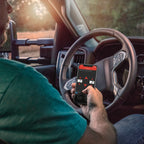 Person using Air Lift Wireless Air Control System w/ Wireless Phone App Control in truck.