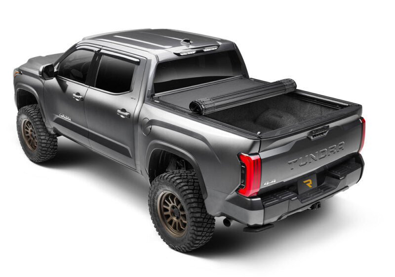 BAK 22-24 Toyota Tundra Revolver X4ts 5.6ft Bed w/T-Slot Rails on offroad truck with exterior accessories.