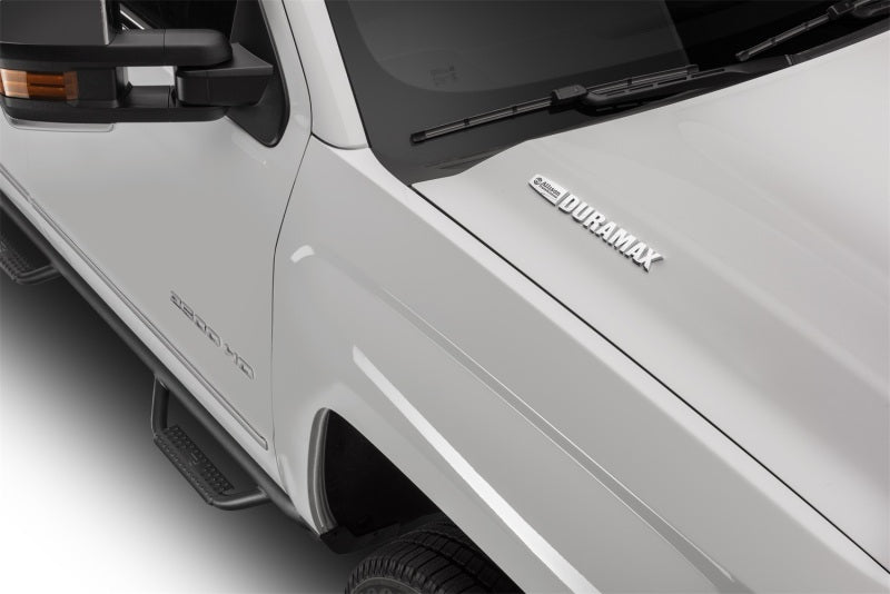 N-Fab Nerf Step 2019 Chevy/GMC 1500 Crew Cab - Cab Length - Tex. Black - 3in, Duramax engine close-up.