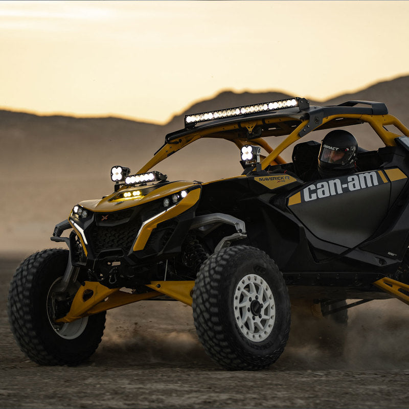 Baja Designs 2024+ Can-Am Maverick R OnX6+ Roof Mount Kit on off-road vehicle in desert.