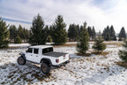 BAK 20-21 Jeep Gladiator Revolver X4s 5ft Bed Cover on truck in snowy field