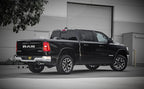 Magnaflow 25+ Ram 1500 I6 3.0L SPEQ Series Polished Cat-Back Performance Exhaust System installed on a black RAM truck.