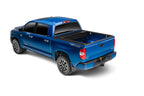 Retrax 2022+ Toyota Tundra (5.7ft Bed w/ Deck Rail System) RetraxONE XR Bed Cover on blue truck.