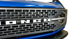 DV8 Offroad 2021+ Ford Bronco Adaptive Cruise Control Relocation Bracket installed on front grille