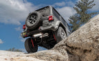 MagnaFlow 18-23 Jeep Wrangler JL 2.0L/3.6L Overland Series Axle-Back Exhaust on rocky terrain