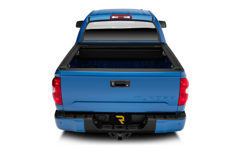 Retrax 2022+ Toyota Tundra (5.7ft Bed w/ Deck Rail System) RetraxONE XR Bed Cover installed on blue truck