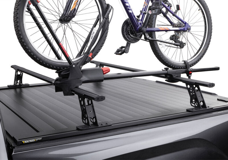 Retrax 2007-2020 Toyota Tundra CrewMax 5.5ft Bed RetraxPRO XR with Deck Rail System, bike rack on the cover.