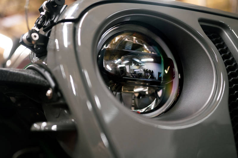 DV8 Offroad 18-22 Jeep Gladiator Wrangler LED Projector Headlights close-up detail for improved offroad visibility.