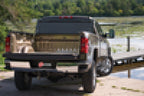 BAK 19-20 Dodge Ram (New Body Style w/o Ram Box) 5ft 7in Bed BAKFlip FiberMax on truck near water.