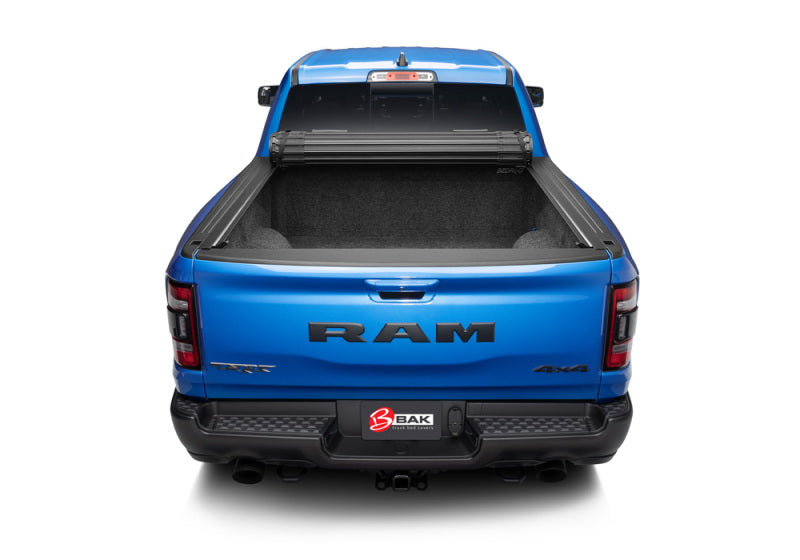 BAK 09-18 Dodge Ram (19-21 Classic) Revolver X4s 8ft Bed Cover on blue truck