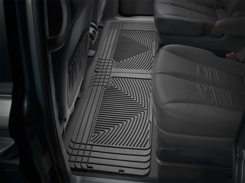 WeatherTech 96 GMC Rally Van Rear Rubber Mats - Black installed in vehicle interior