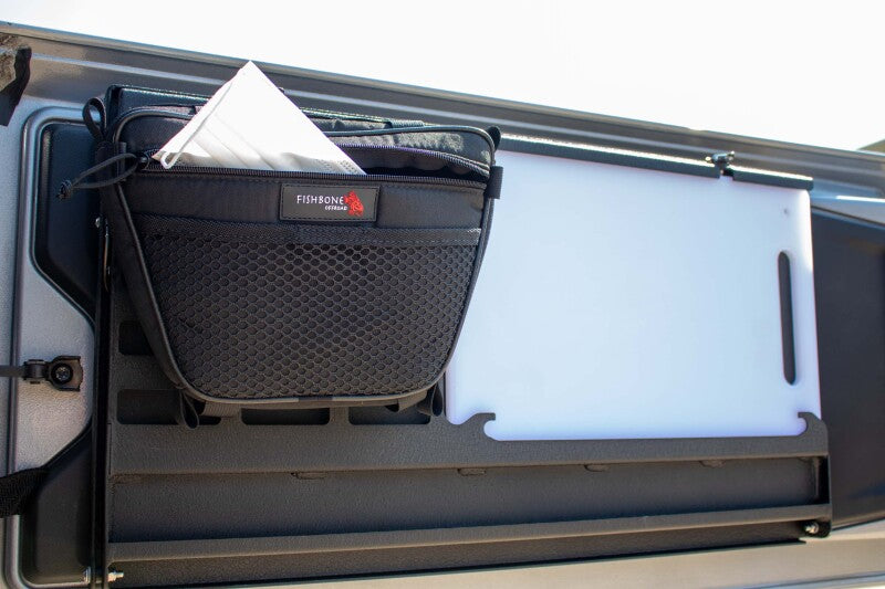 Fishbone Offroad 2018+ Jeep Wrangler JL Tailgate Table setup with storage basket.