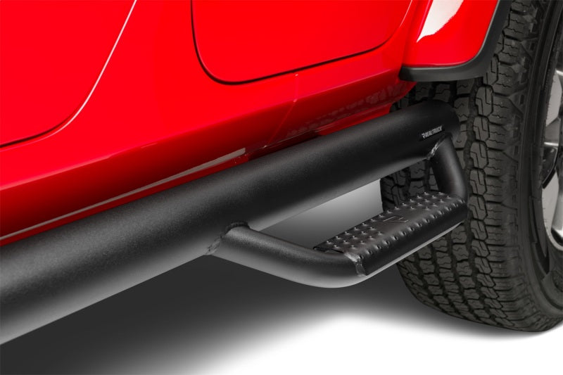 N-Fab Nerf Step 2018 Jeep Wrangler JL SUV 4 Door- Tex. Black - W2W - 3in. installed on red Jeep with textured surface.