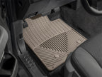 WeatherTech 98 Chevrolet Tracker Front Rubber Mats - Tan in vehicle footwell