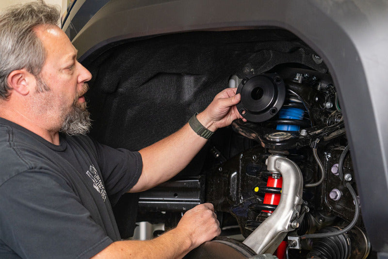 Installing ICON 2024 Toyota Tacoma Top Plate Reinforcement Kit for offroad performance upgrades.