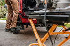 AMP Research 2023 Ford F-250 Super Duty BedStep - Black in use with truck cargo