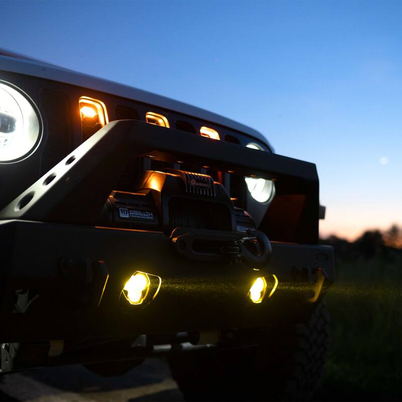 KC HiLiTES FLEX ERA 3 Dual Mode SAE Fog Lights - 2-Light Master Kit for Jeep Aftermarket Bumpers on vehicle at dusk