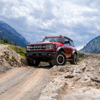 AirLift Performance 21-24 Ford Bronco LoadLifter 5000 Air Spring Kit in action on off-road terrain.