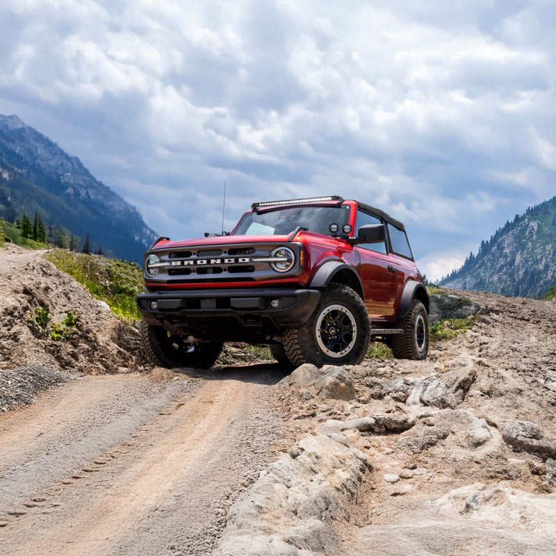 AirLift Performance 21-24 Ford Bronco LoadLifter 5000 Air Spring Kit in action on off-road terrain.