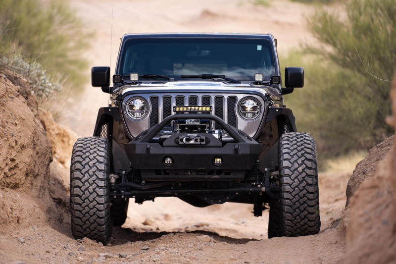 DV8 Offroad 18-22 Jeep Gladiator JT Cowl Light Bar Bracket in action on a rugged trail