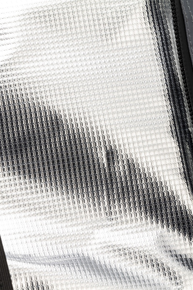 Silver reflective surface of ARB Cooler Bag Charcoal w/ Red Highlights 15in L x 11in W x 9in H Holds 22 Cans