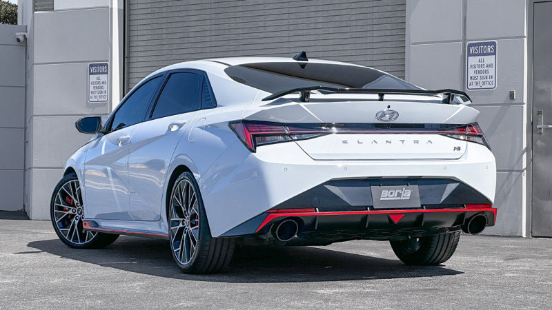 Borla 22-23 Hyundai Elantra N 2.0L 4 CYL. Turbo AT/MT ATAK Catback Exhaust Black Chrome showcased on a white vehicle.