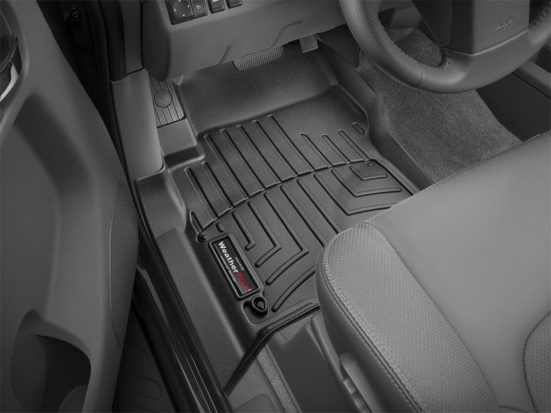 WeatherTech 08+ Nissan Frontier Front FloorLiner - Black installed in truck interior