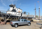 BAK 00-06 Toyota Tundra Double Cab 6ft 2in Bed BAKFlip G2 parked by a boat.