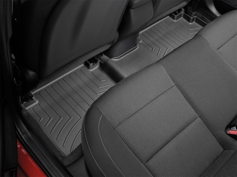 WeatherTech 19+ Kia Forte Sedan Rear FloorLiner - Black in car interior.