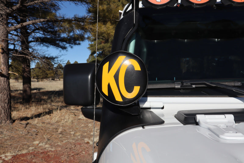 KC HiLiTES 6in. Round Soft Cover (Pair) - Black w/Yellow KC Logo on Jeep