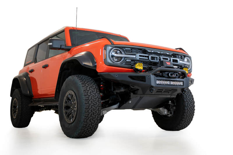 Addictive Desert Designs 22-23 Ford Bronco Raptor Rock Fighter Skid Plate on offroad truck with performance upgrades