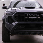 Baja Designs 2024+ Toyota Tacoma S8 Series 10in Grille Conversion Light Kit on black Tacoma