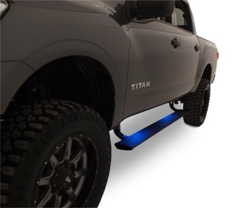 AMP Research 16-18 Nissan Titan All Cabs PowerStep - Black on truck with offroad tires and lighting