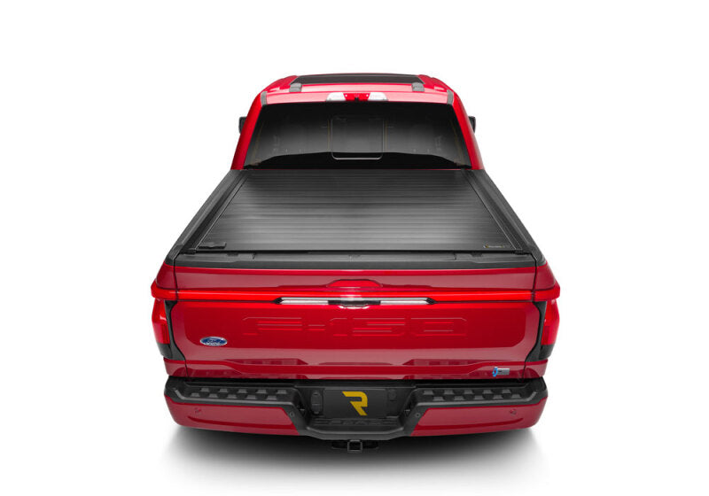 Retrax 21-22 Ford F-150 Super Crew/Super Cab (Incl. 2022 Lightning) 5.5ft Bed RetraxPRO MX installed on a red truck.