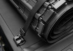 BAK 19-21 Chevy Silverado/GM Sierra Revolver X4s 5.10ft Bed Cover rolled with strap, showcasing durability and style.