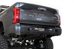 Addictive Desert Designs 22-23 Toyota Tundra Stealth Fighter Winch Rear Bumper on offroad truck with rugged detailing.