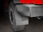 WeatherTech 2021+ Ford Bronco No Drill Rear MudFlaps - Black installed on a red truck.