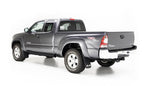 AMP Research 2016-2017 Toyota Tacoma Double Cab/Access PowerStep - Black on gray truck with offroad tires.